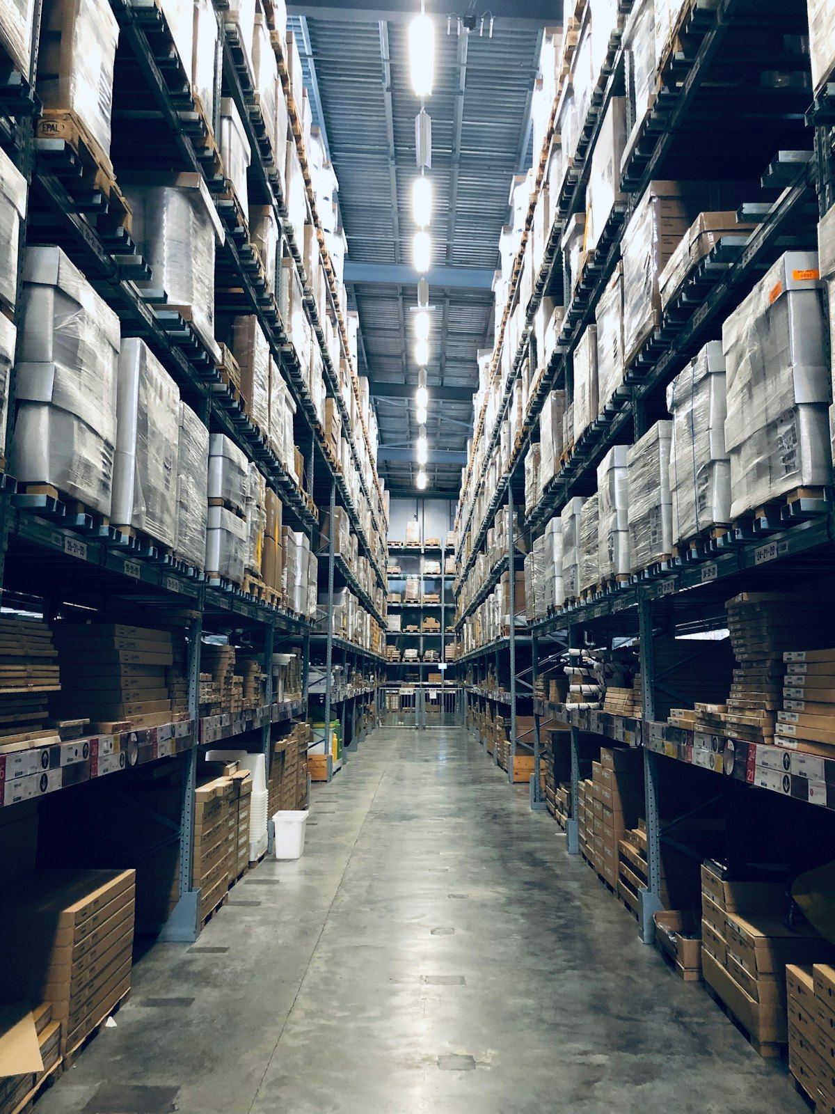 Inside a large warehouse with stocked shelves