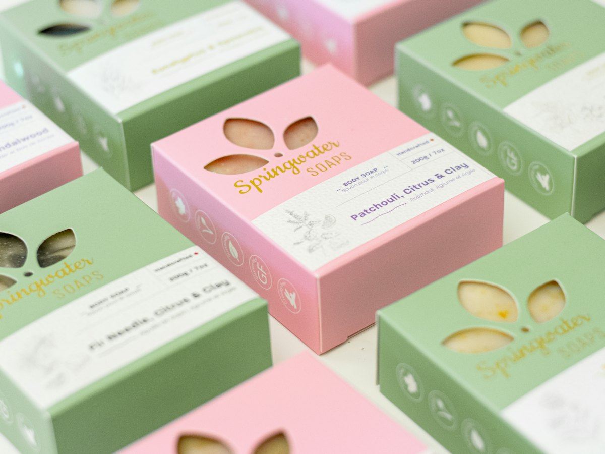 Branded green and pink product boxes